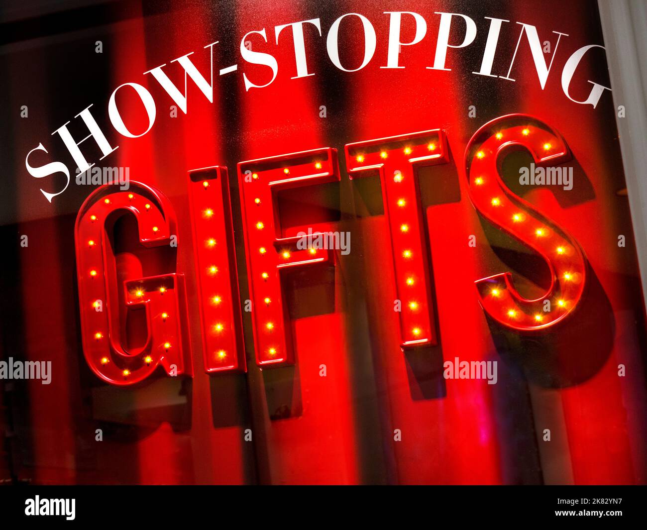 CHRISTMAS SHOPPING WINDOW SHOP STORE SIGN Graphic Christmas.shop window display 'Show-stopping GIFTS' Stock Photo