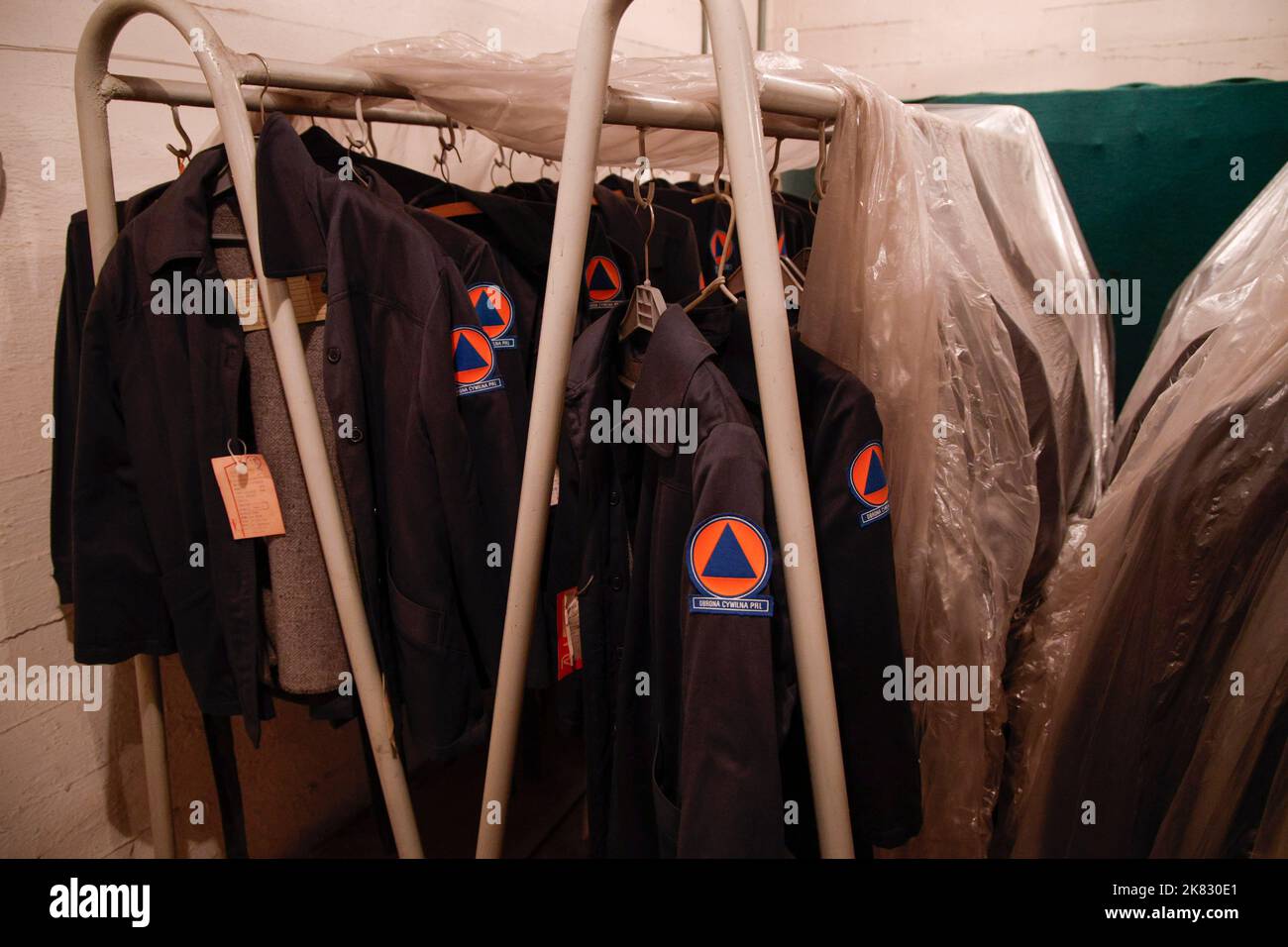 Warsaw, Poland. 20th Oct, 2022. Uniforms of the Soviet era Civial Defence Forces (Obrona Cywilna PRL) are seen in a disused bomb shelter in Warsaw, Poland on 20 October, 2022. Polish fire services are taking inventory of the country's 62 thousand bomb shelters.  Deputy Interior Minister Maciej Wasik said while the country is not under threat preparations for a 'worst case scenario' need to be made. Polish presidnet Andrzej Duda during an interview with Italian television said under threat of what he called Russia's 'new imperialism' Poland could be next if Ukraine falls. (Photo by Jaap Arriens Stock Photo