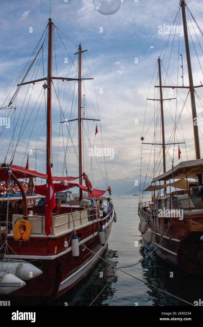 Turkey, Antalya. Kaleiçi. Old fishing port. In the background the peaks of the Taurus Mountains. Gulf of Antalya. Anatolian Peninsula Stock Photo
