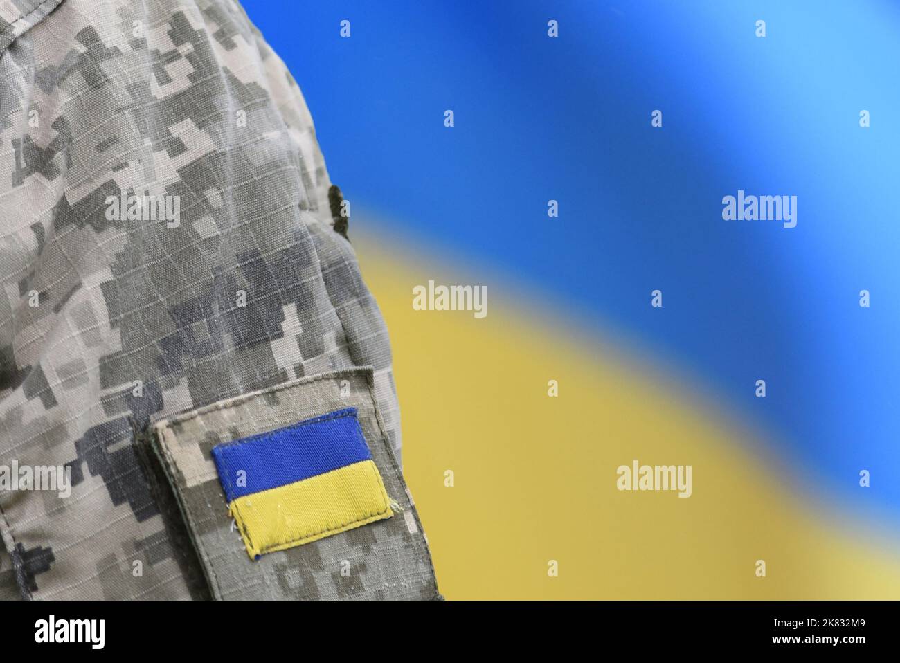 Armed Forces of Ukraine. Ukrainian soldier. Ukrainian in army. Ukrainian flag on military uniform. Stock Photo