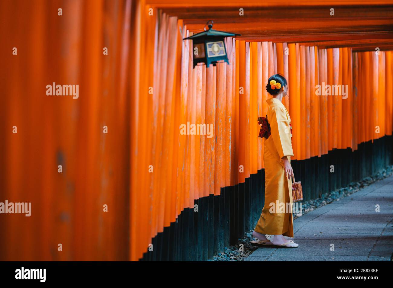 Japanese woman at Fushimi Inari Shrine, Kyoto, Japan Stock Photo