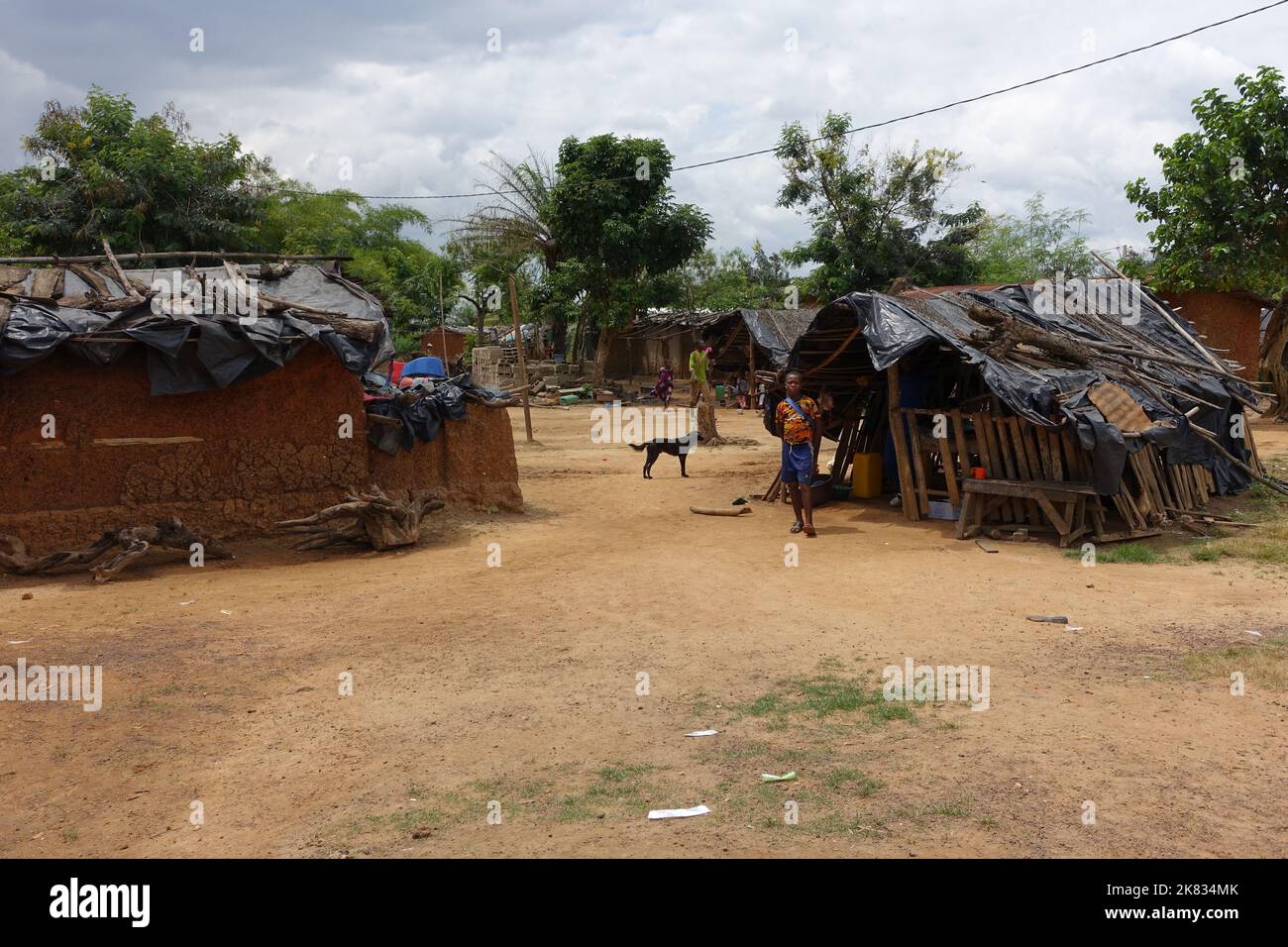 Electric wires bring power to a village in Ivory Coast Stock Photo