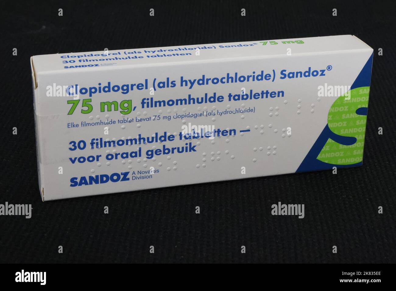Photo of package of clopidogrel tablets, (an antiplatelet medication, blood thinner) produced by Sandoz, a Novartis division Stock Photo
