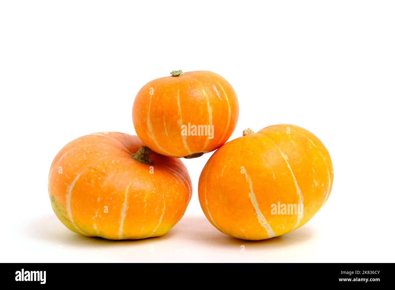 Three pumpkins white background, isolate Stock Photo