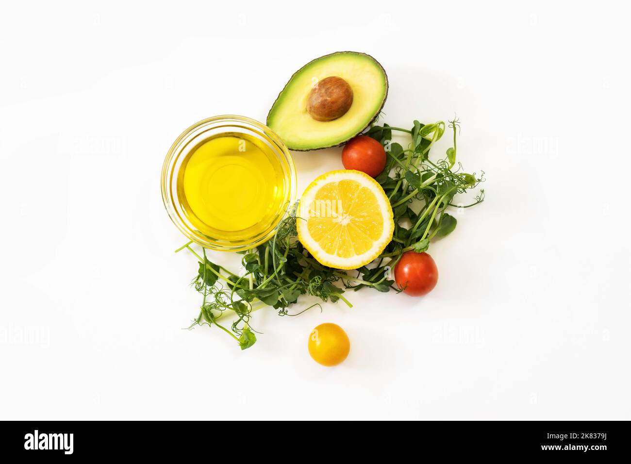 Ingredients of healthy food. Micro green pea sprouts, olive oil