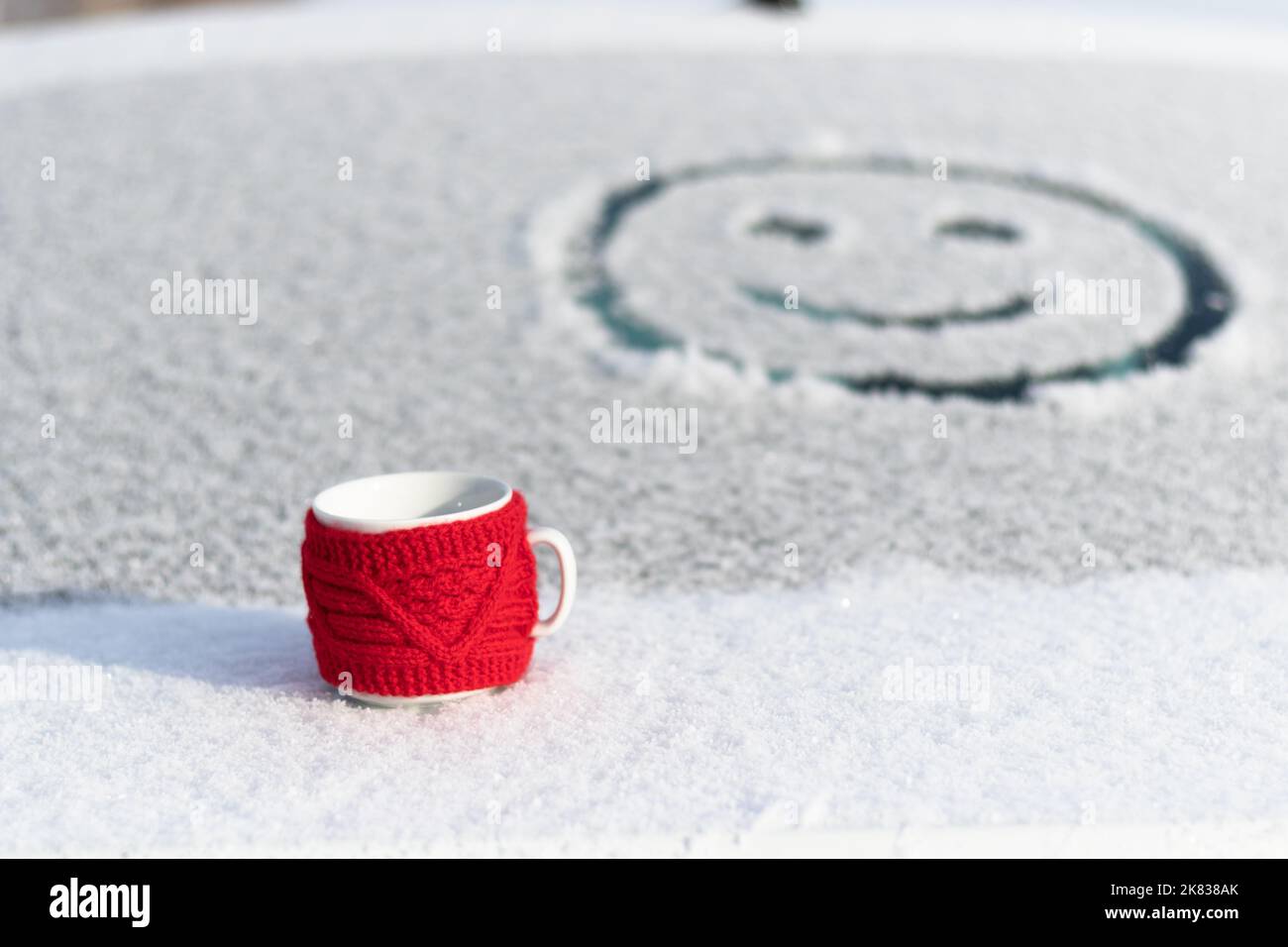 Hot Coffee cup on a frosty winter day window background