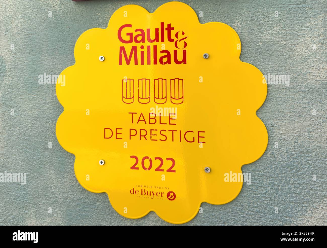 Ribeauville, France - Sep 22, 2022: Signage at the entrance of restaurant - Gault Milau guide table de prestige 2022 - de buyer Stock Photo