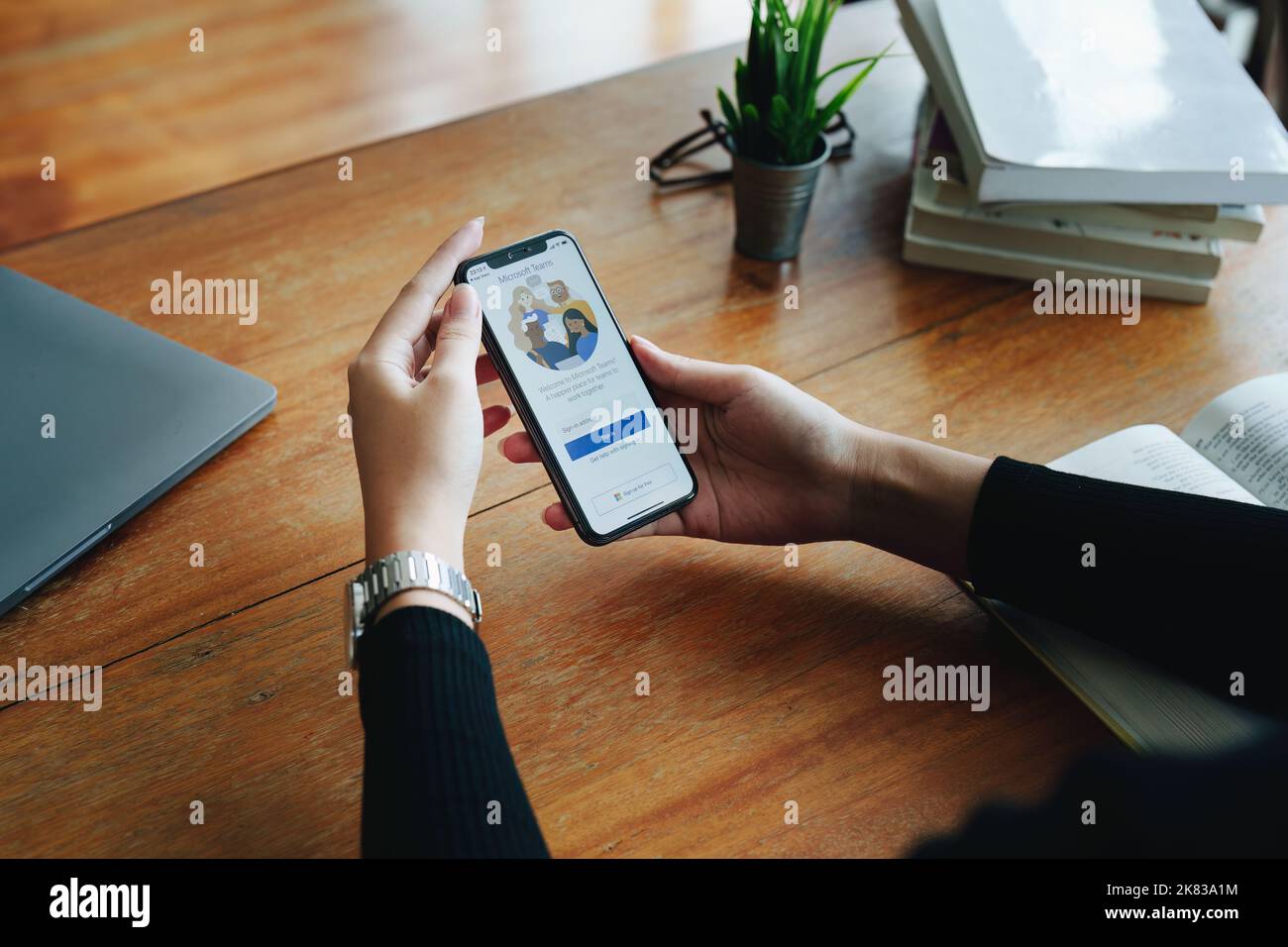 CHIANG MAI, THAILAND - Jun29, 2022 : A working from home employee is downloading the Microsoft Teams social platform, ready for remote working in Stock Photo