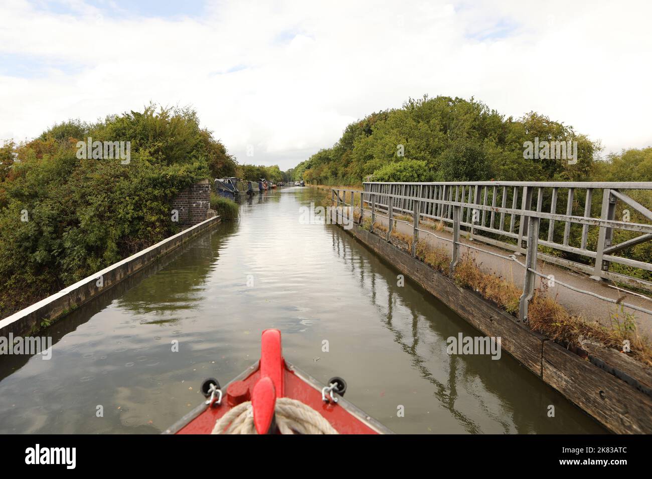 A narrow boat crossing Cosgrove aqueduct on the Grand Union Canal, Buckinghamshire, United Kingdom Stock Photo