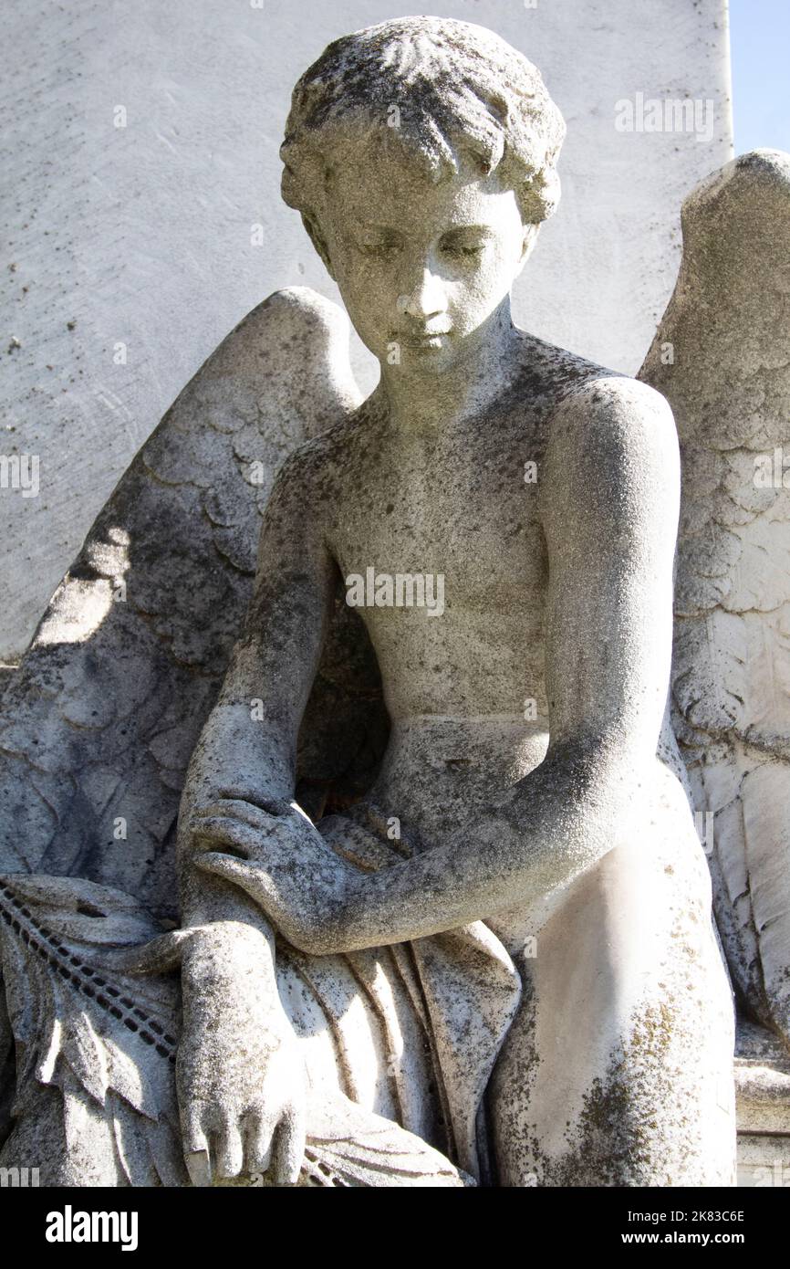 Statue of an child angel in Kerepesi Cemetery Budapest Hungary Stock Photo