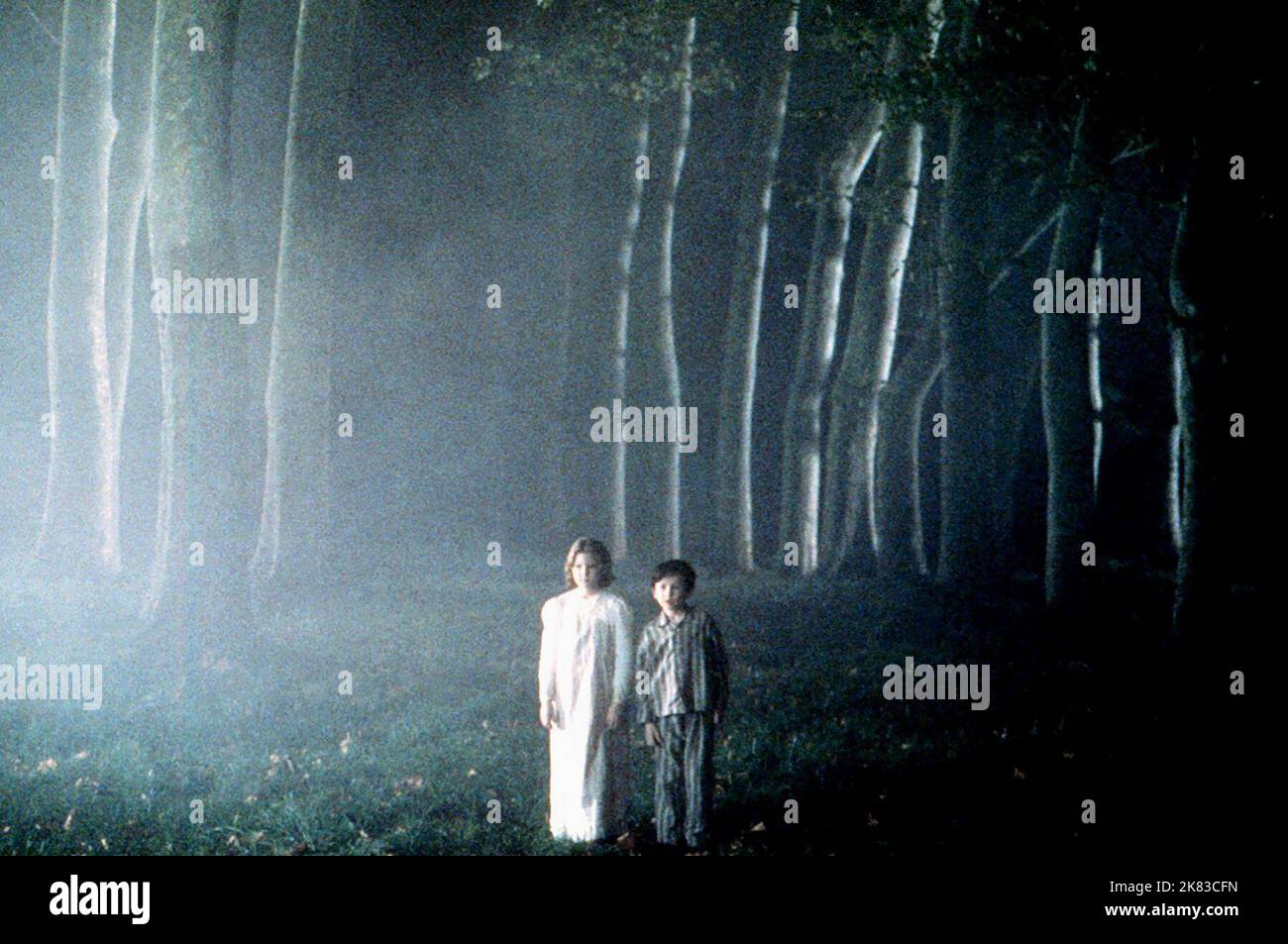 Alakina Mann & James Bentley Film: The Others (USA/ES/FR/IT 2001) Characters: Anne Stewart & Nicholas Stewart  Director: Alejandro Amenabar 02 August 2001   **WARNING** This Photograph is for editorial use only and is the copyright of DIMENSION FILMS and/or the Photographer assigned by the Film or Production Company and can only be reproduced by publications in conjunction with the promotion of the above Film. A Mandatory Credit To DIMENSION FILMS is required. The Photographer should also be credited when known. No commercial use can be granted without written authority from the Film Company. Stock Photo