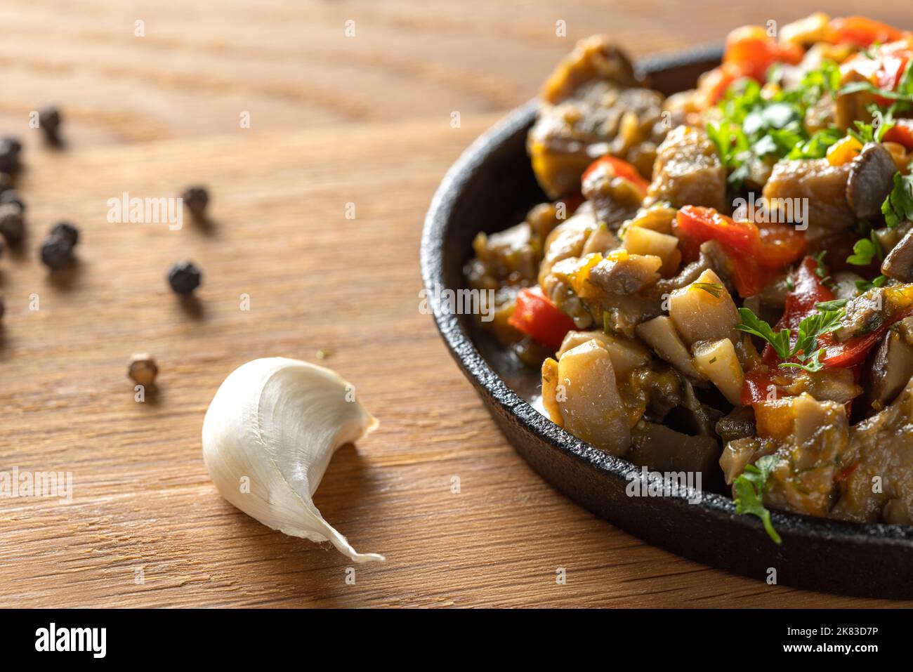 Mushroom stew with a lot of vegetables on wood - close up view Stock Photo