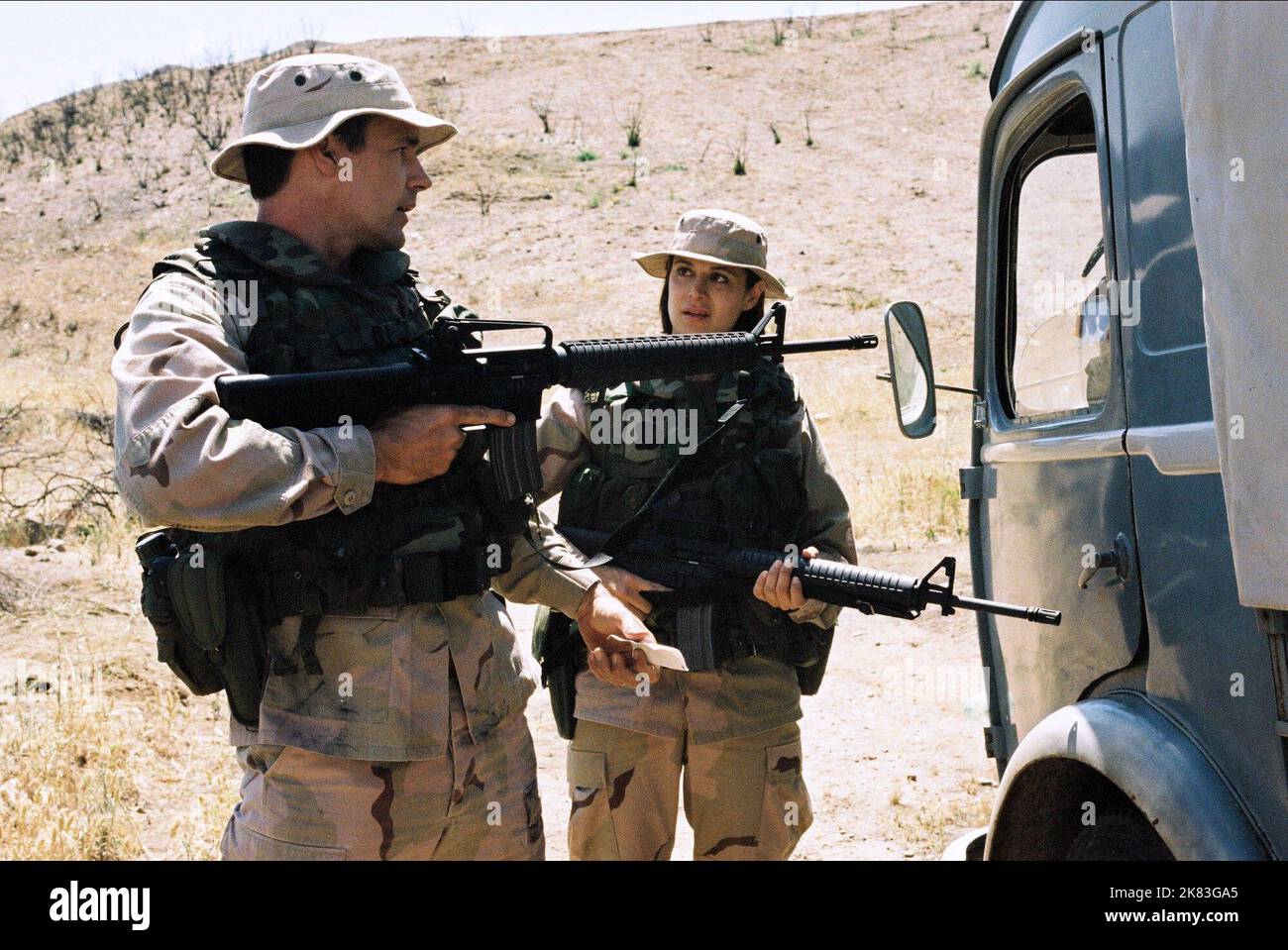 David James Elliott & Catherine Bell Television: Jag (TV-Serie) Characters: Cmdr. Harmon 'Harm' Rabb, Jr. & Lt. Col. Sarah 'Mac' MacKenzie  Usa 1995-2005, / 7. Staffel, Season 7 25 September 2001   **WARNING** This Photograph is for editorial use only and is the copyright of NBC and/or the Photographer assigned by the Film or Production Company and can only be reproduced by publications in conjunction with the promotion of the above Film. A Mandatory Credit To NBC is required. The Photographer should also be credited when known. No commercial use can be granted without written authority from t Stock Photo