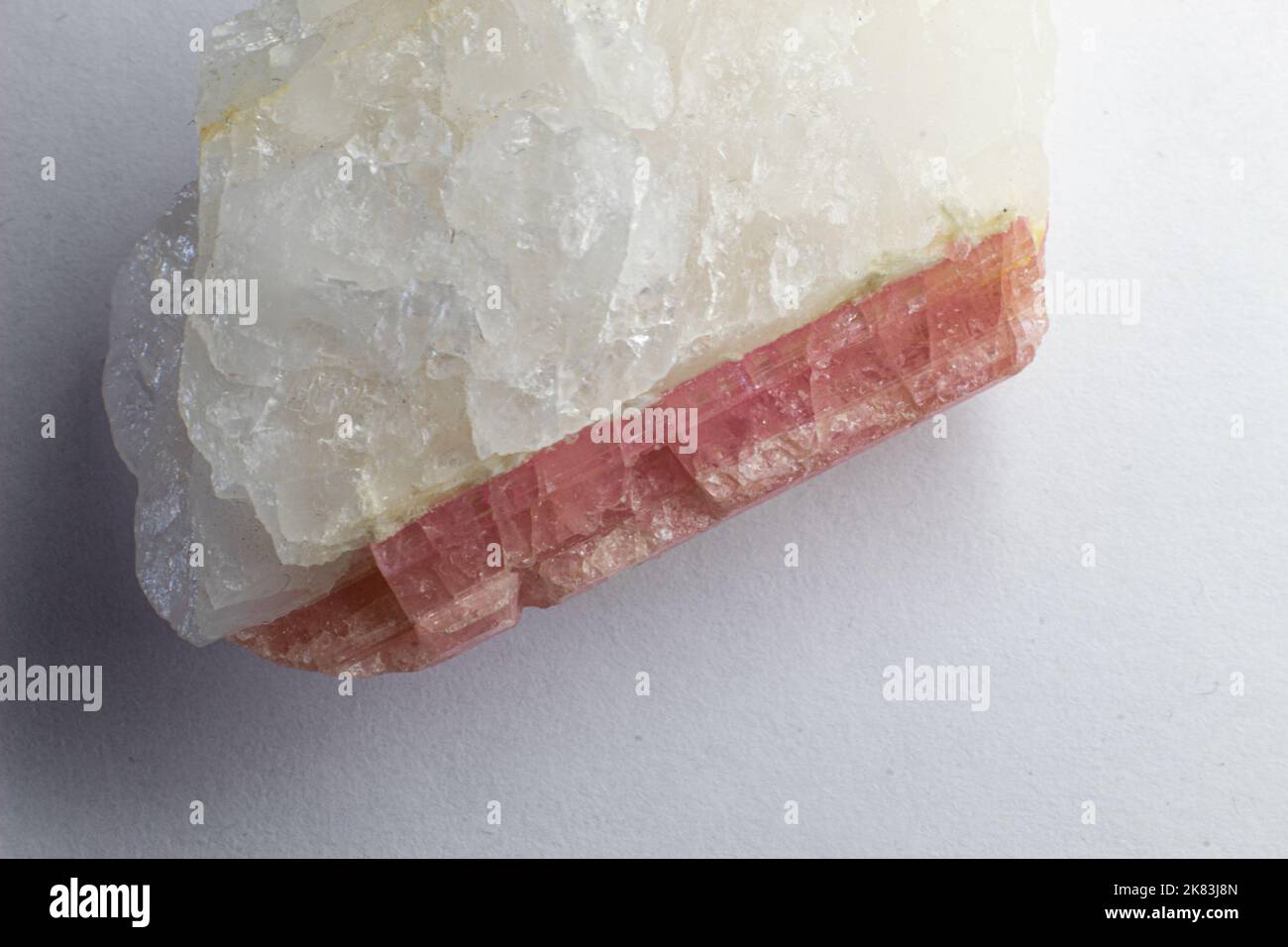 Macro top photography of white quartz with pink tourmaline  - rubellite. Rose stone Stock Photo