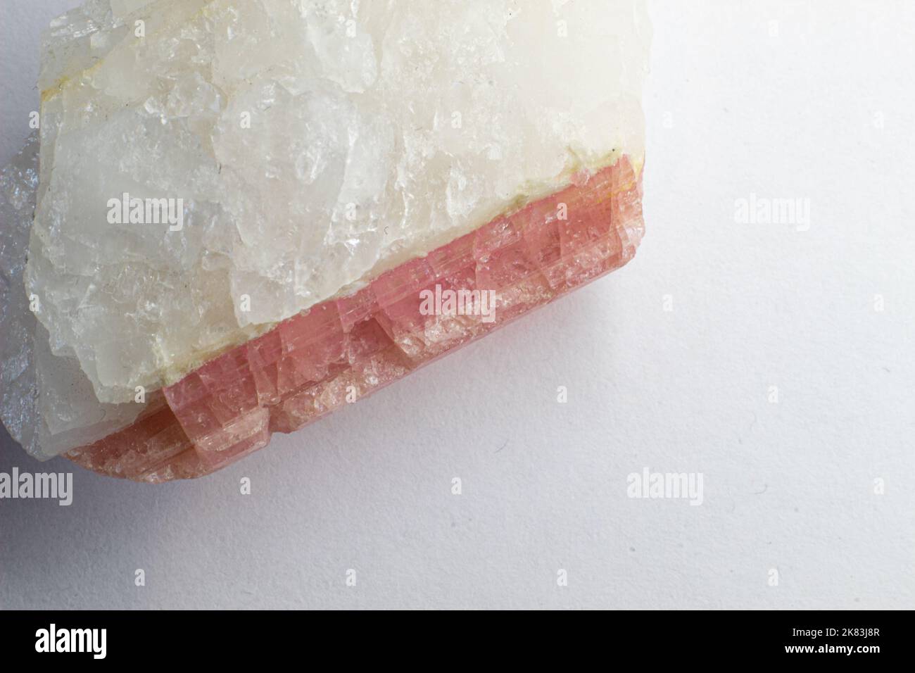 Macro top photography of white quartz with pink tourmaline  - rubellite. Rose stone Stock Photo