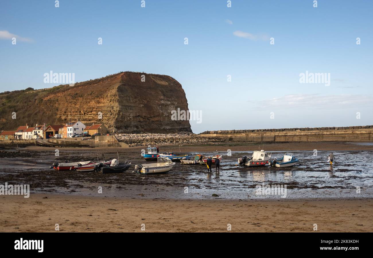 Fishing boats stranded in Staithes Harbour, North Yorkshire, at low ...