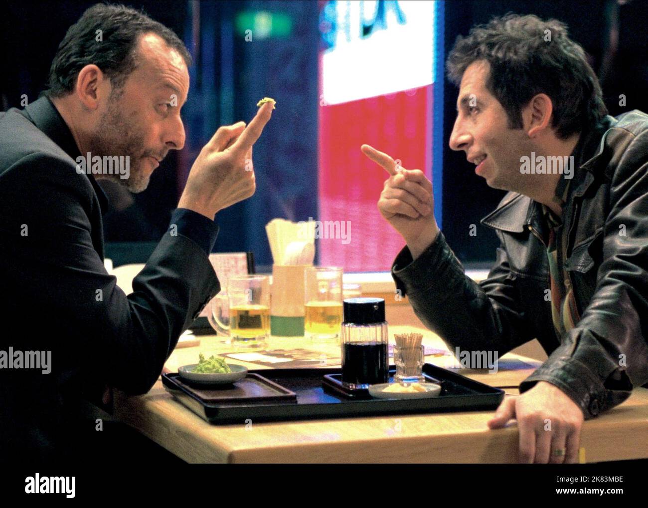 Jean Reno & Michel Muller Film: Wasabi (2001) Characters: Hubert Fiorentini, Maurice 'Momo'  Director: Gerard Krawczyk 31 October 2001   **WARNING** This Photograph is for editorial use only and is the copyright of TRISTAR PICTURES and/or the Photographer assigned by the Film or Production Company and can only be reproduced by publications in conjunction with the promotion of the above Film. A Mandatory Credit To TRISTAR PICTURES is required. The Photographer should also be credited when known. No commercial use can be granted without written authority from the Film Company. Stock Photo