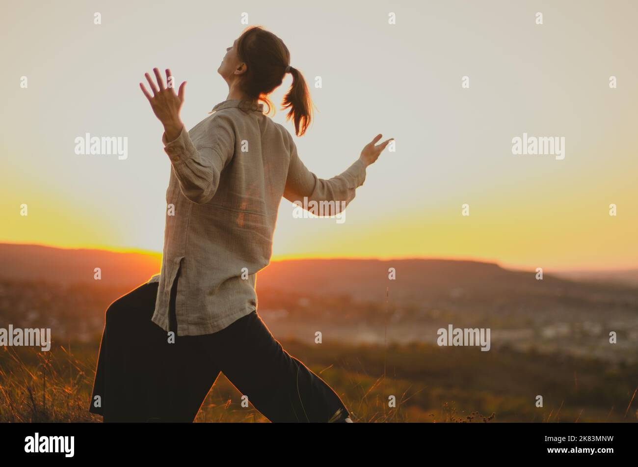 Woman arms outstretched sun hi-res stock photography and images - Alamy