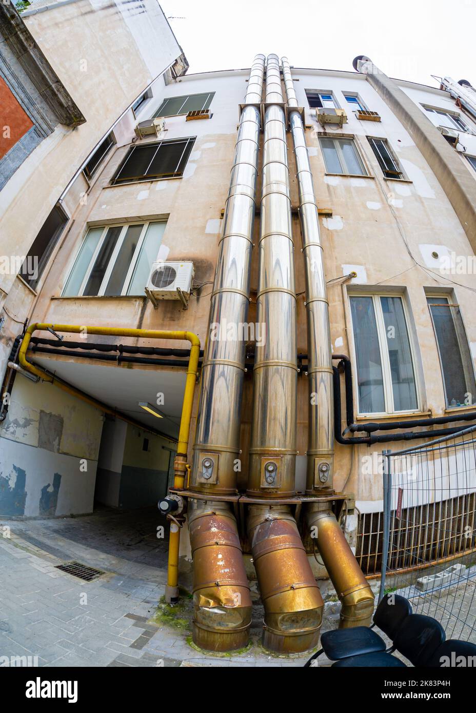 Building in Naples with ventilation pipes on the outside Stock Photo