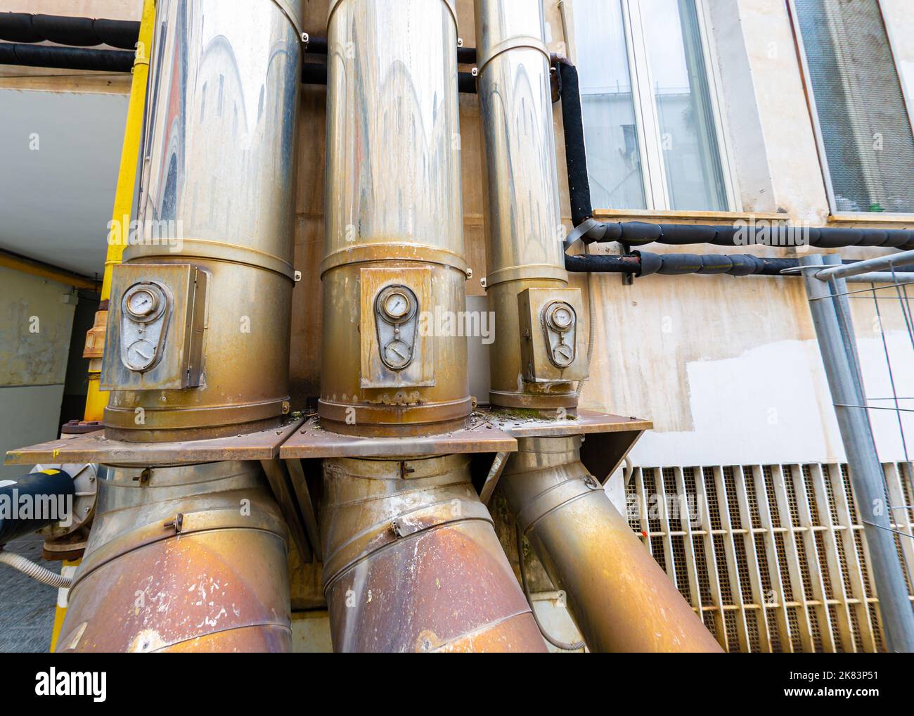 Building in Naples with ventilation pipes on the outside Stock Photo
