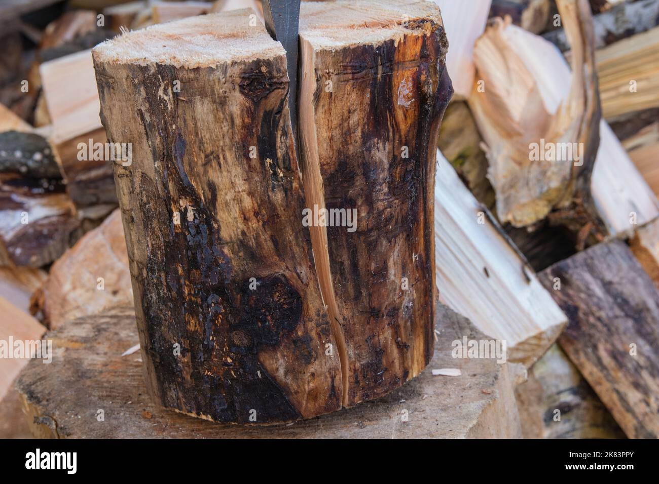 An ax and a stump while chopping firewood on a clear day Stock Photo ...