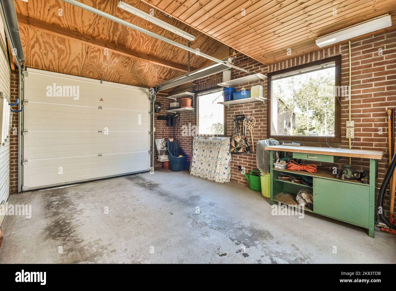 Storage room with pipes and metering devices. A long room with engineering communications in the modern apartment Stock Photo