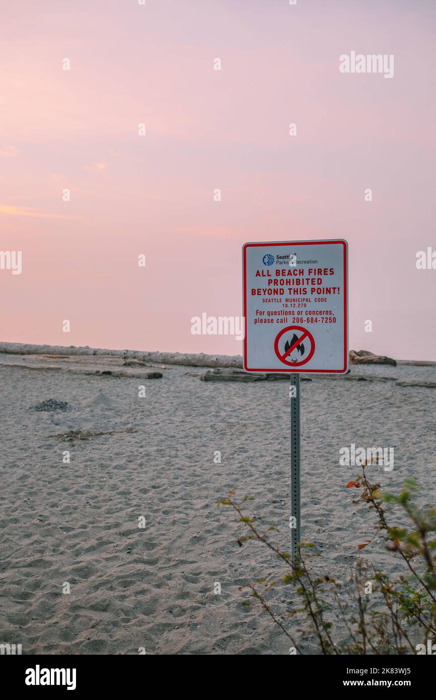 Seattle Parks & Recreation Department sign stating 'All beach fires prohibited beyond this point!' at Carkeek Park Stock Photo