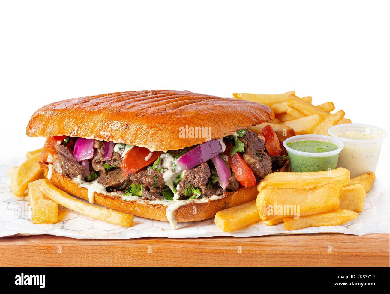 Large Peruvian Lomo saltado beef sandwich with French fries on a white background Stock Photo