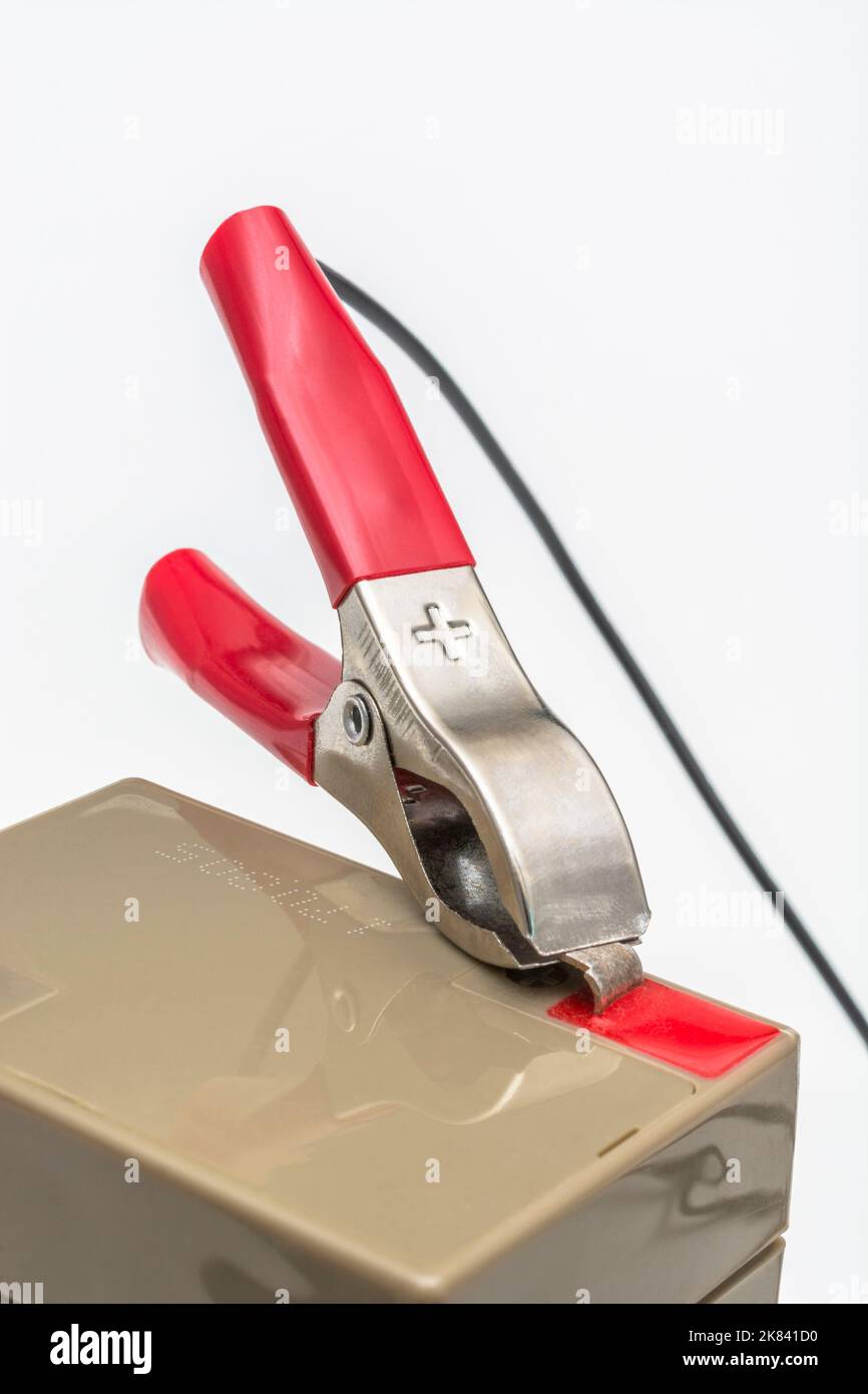 Red positive / +'ve battery terminal crocodile clip / alligator clamp. For electricity, positive