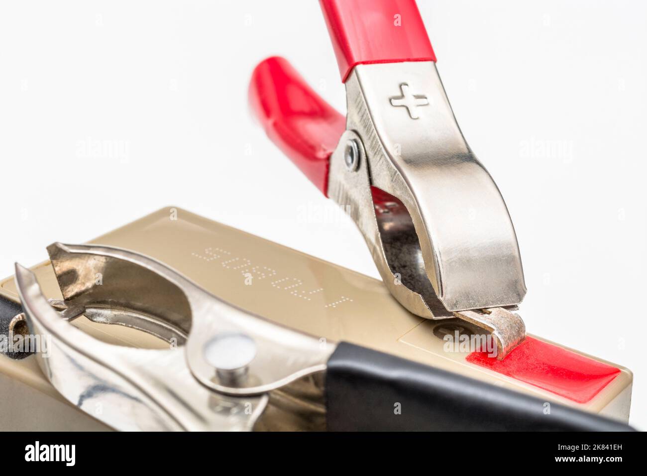 Red positive / +'ve battery terminal crocodile clip / alligator clamp. For electricity, positive