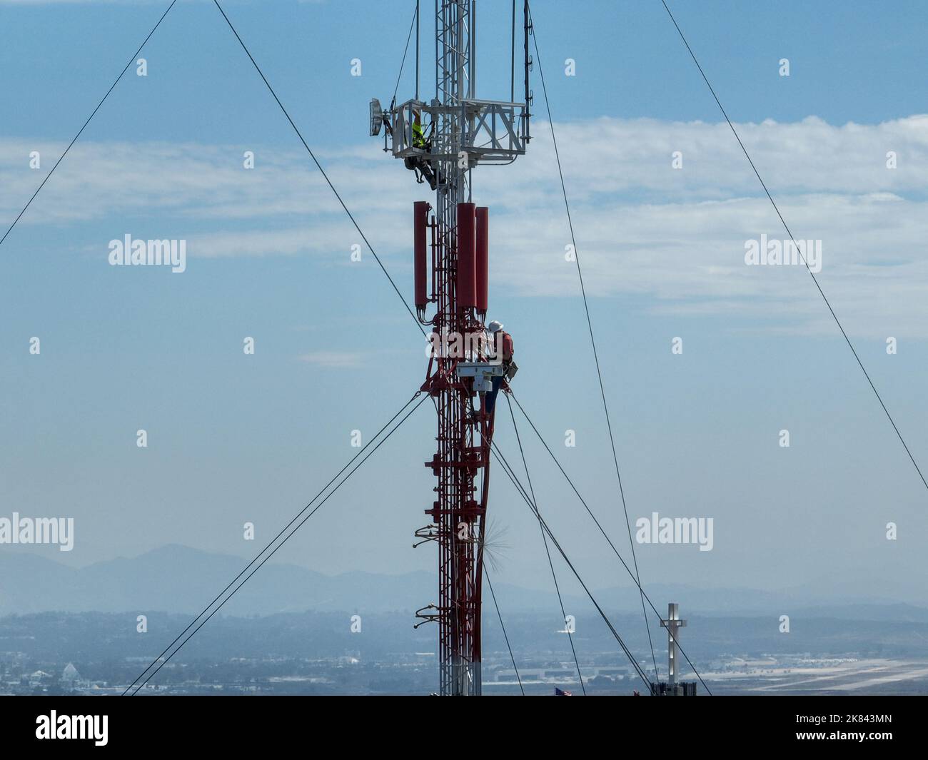 Engineer with safety equipment on high tower for working