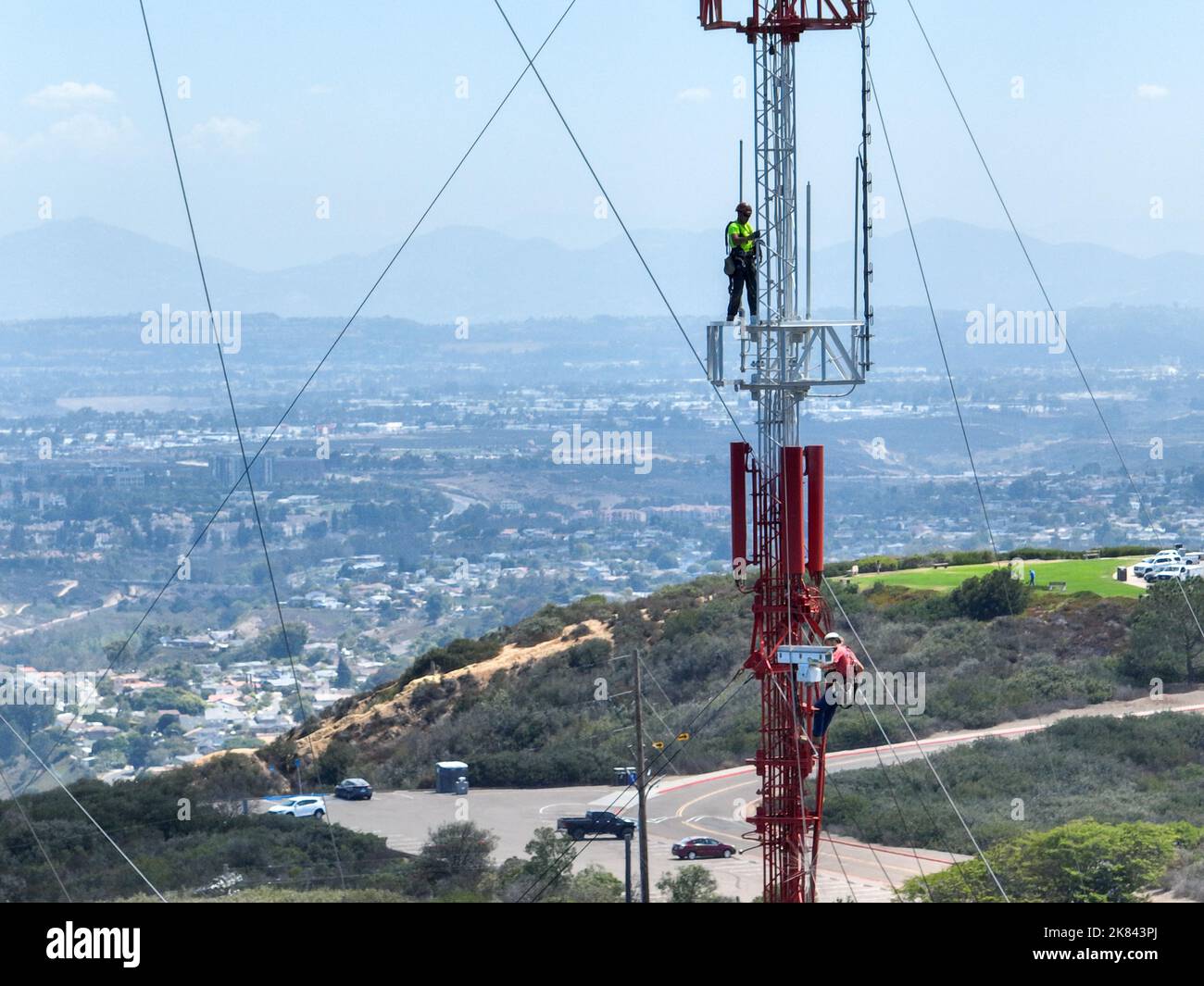 Engineer with safety equipment on high tower for working
