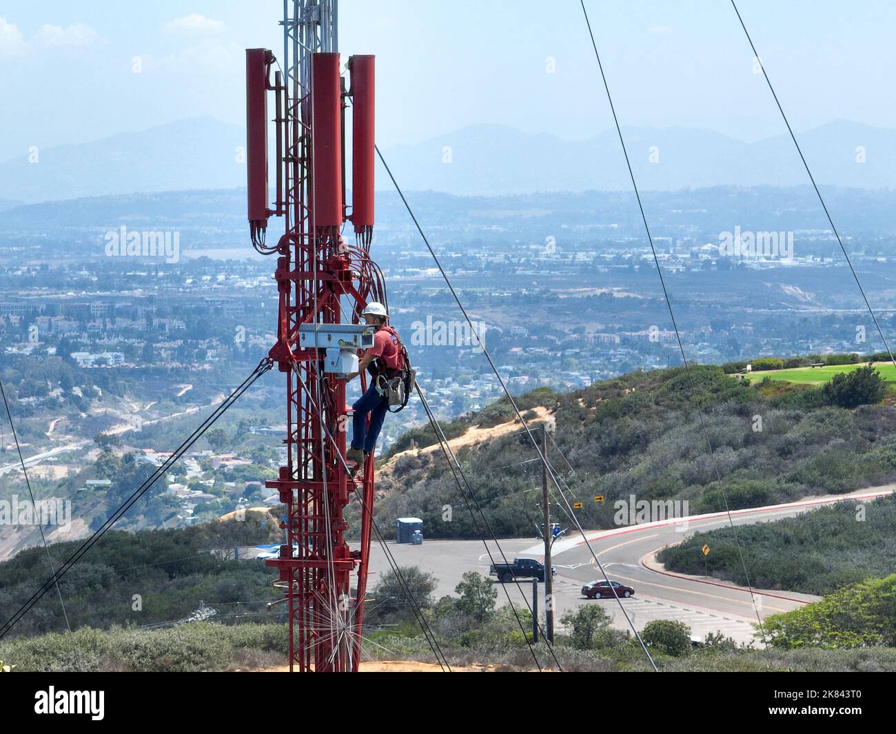 Engineer with safety equipment on high tower for working