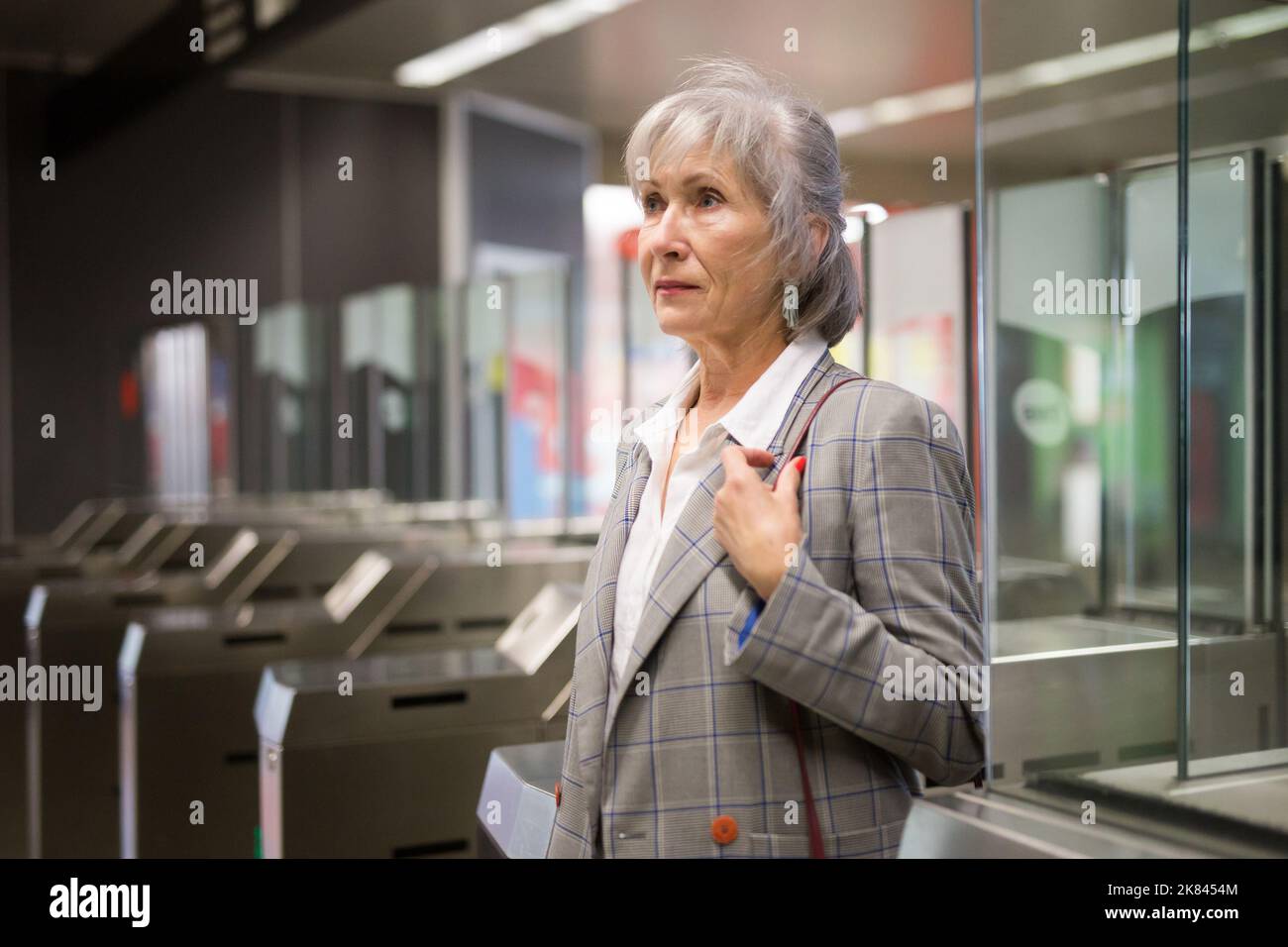 senior-woman-at-entrance-to-subway-station-stock-photo-alamy