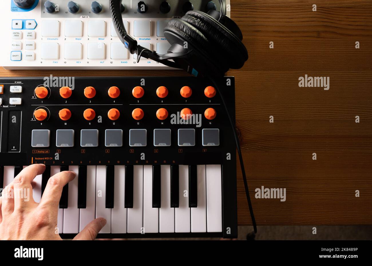 Studio headphones on a midi keyboard. Professional equipment for