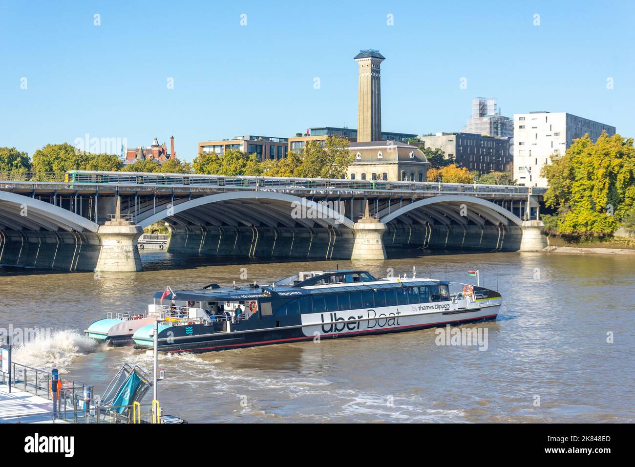 Uber boat leaving battersea power station pier river thames west hi-res