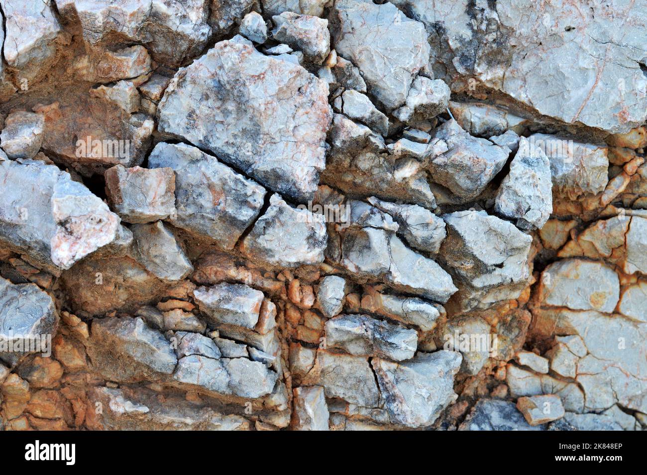Cracked stone background. Close up of cracked mountain rock Stock Photo