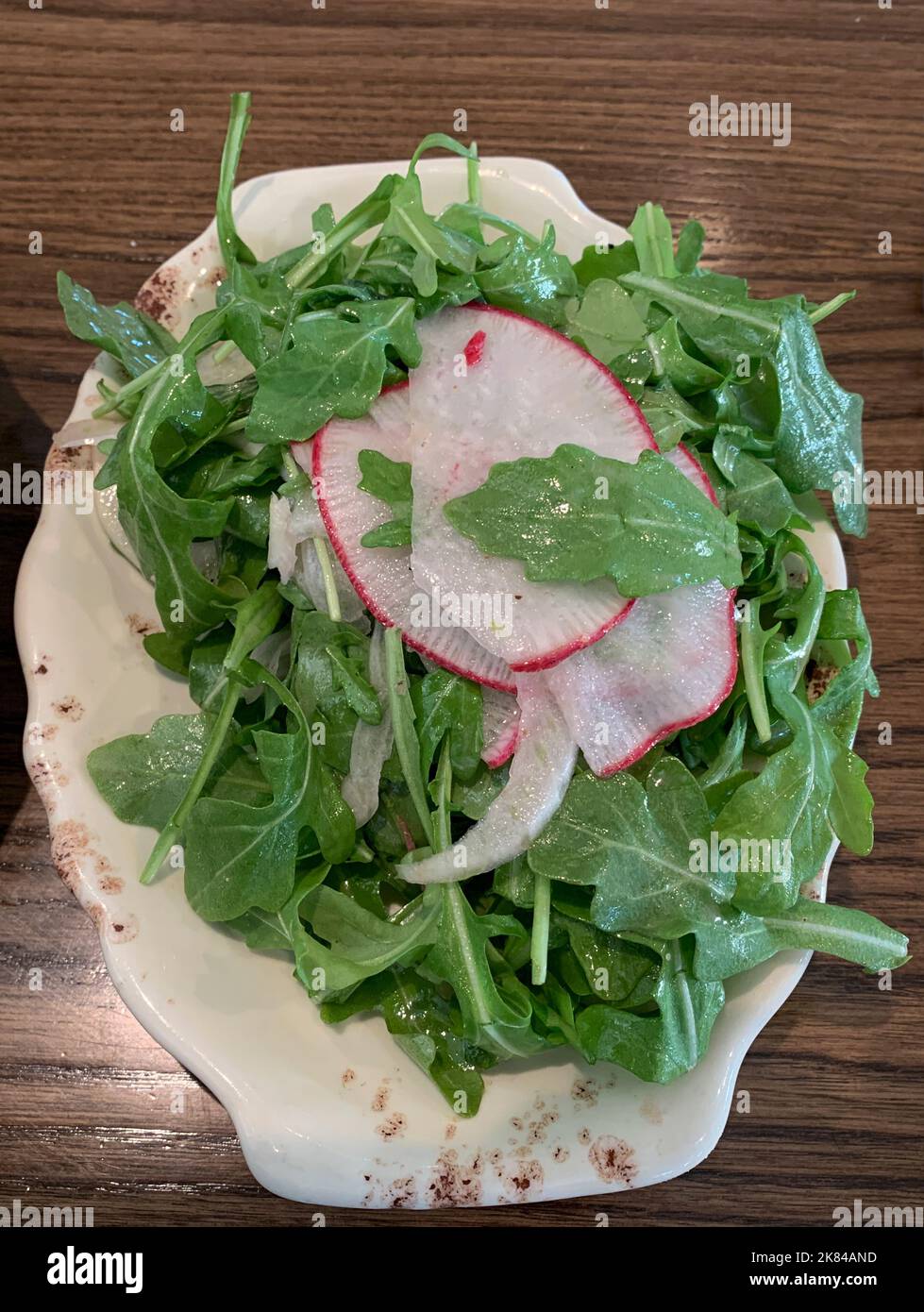 Arugula salad with Radish Garnish. Stock Photo