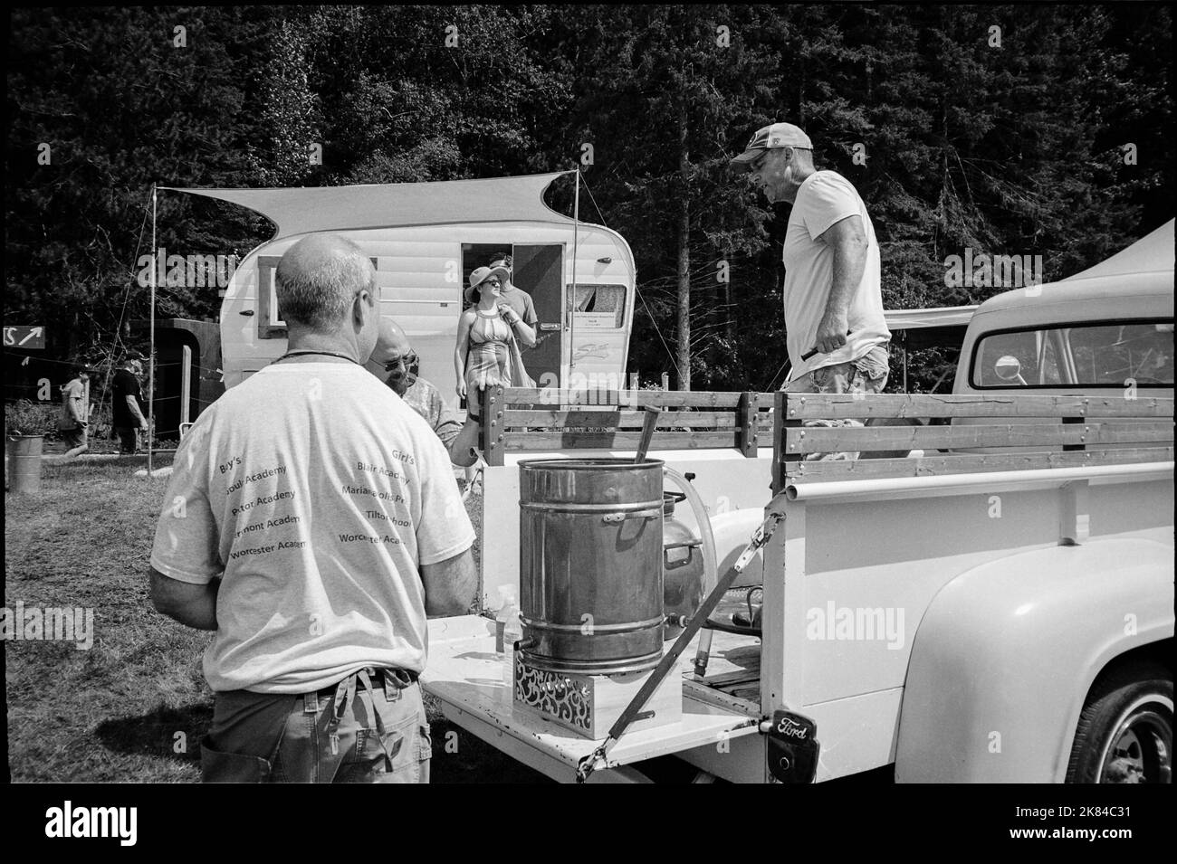 A representative of Lavender Fields at Puckin Blossom Farms discusses his distillation methods with a visitor at the League of New Hampshire Craftsman Stock Photo