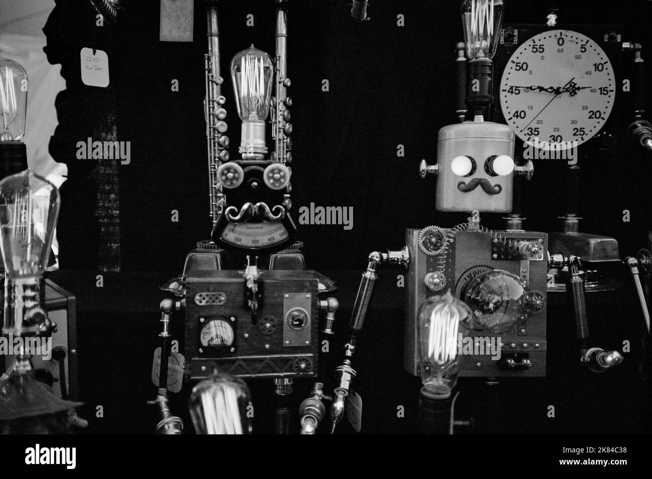 Steampunk sculptures are on display for sale at the League of New Hampshire Craftsmen fair in Lake Sunapee, New Hampshire. Image captured on analog bl Stock Photo