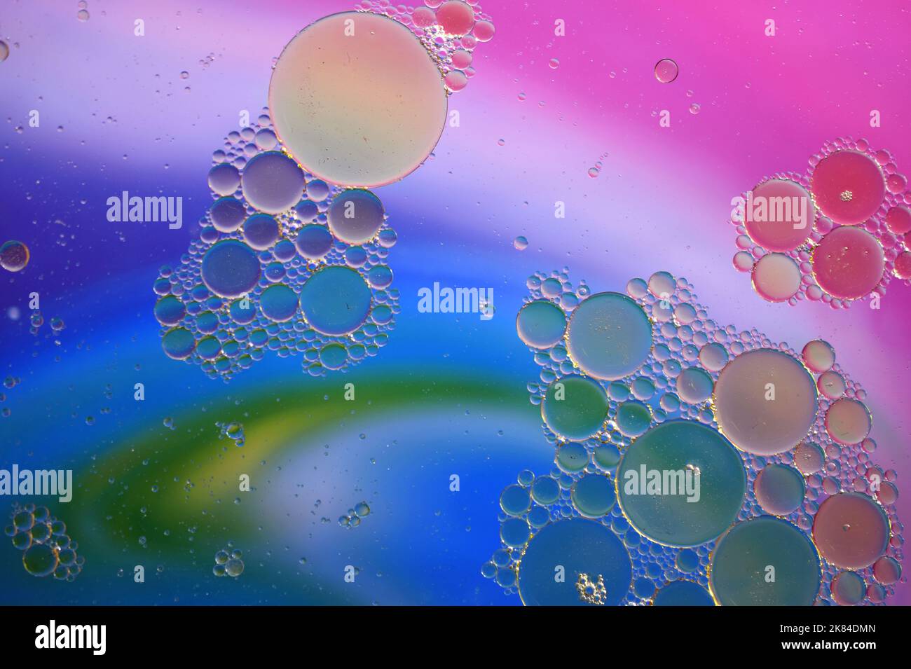 Water Drops on Rainbow Multicolored background Stock Photo