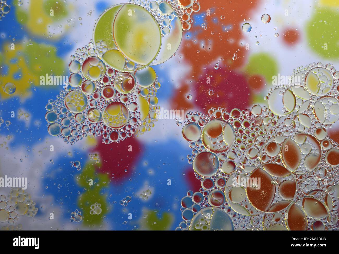 Water Drops on Rainbow Multicolored background Stock Photo