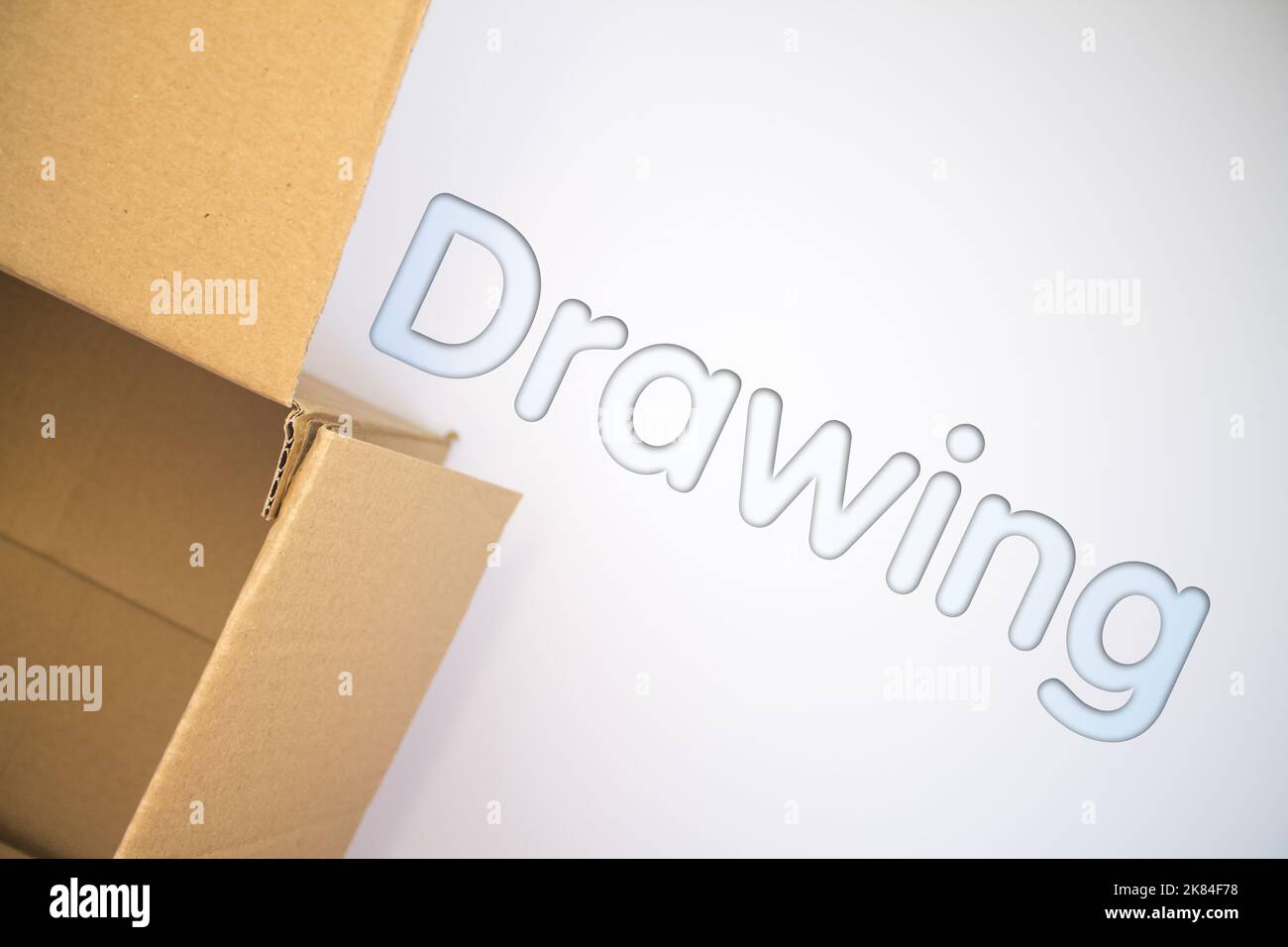 Drawing word with cardboard box. Brown folded card box Stock Photo - Alamy