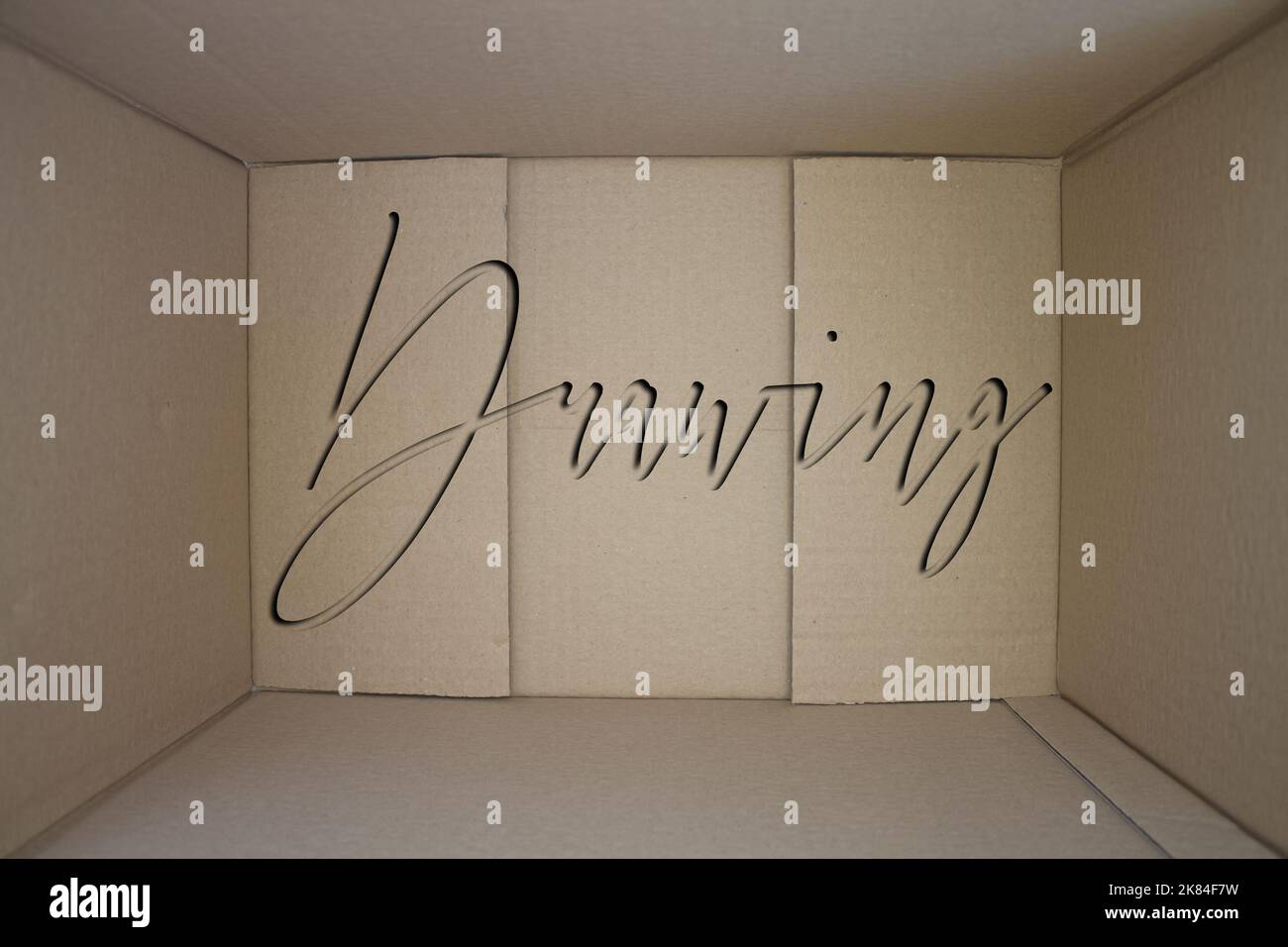 Drawing word with cardboard box. Brown folded card box Stock Photo - Alamy
