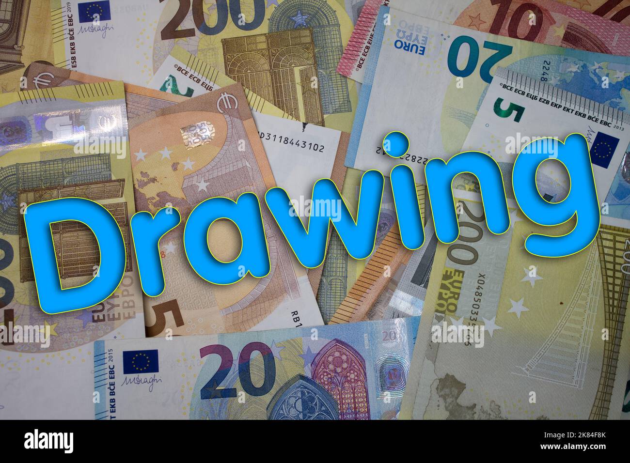 Drawing word with money. Paper currency background with different banknotes. Stock Photo