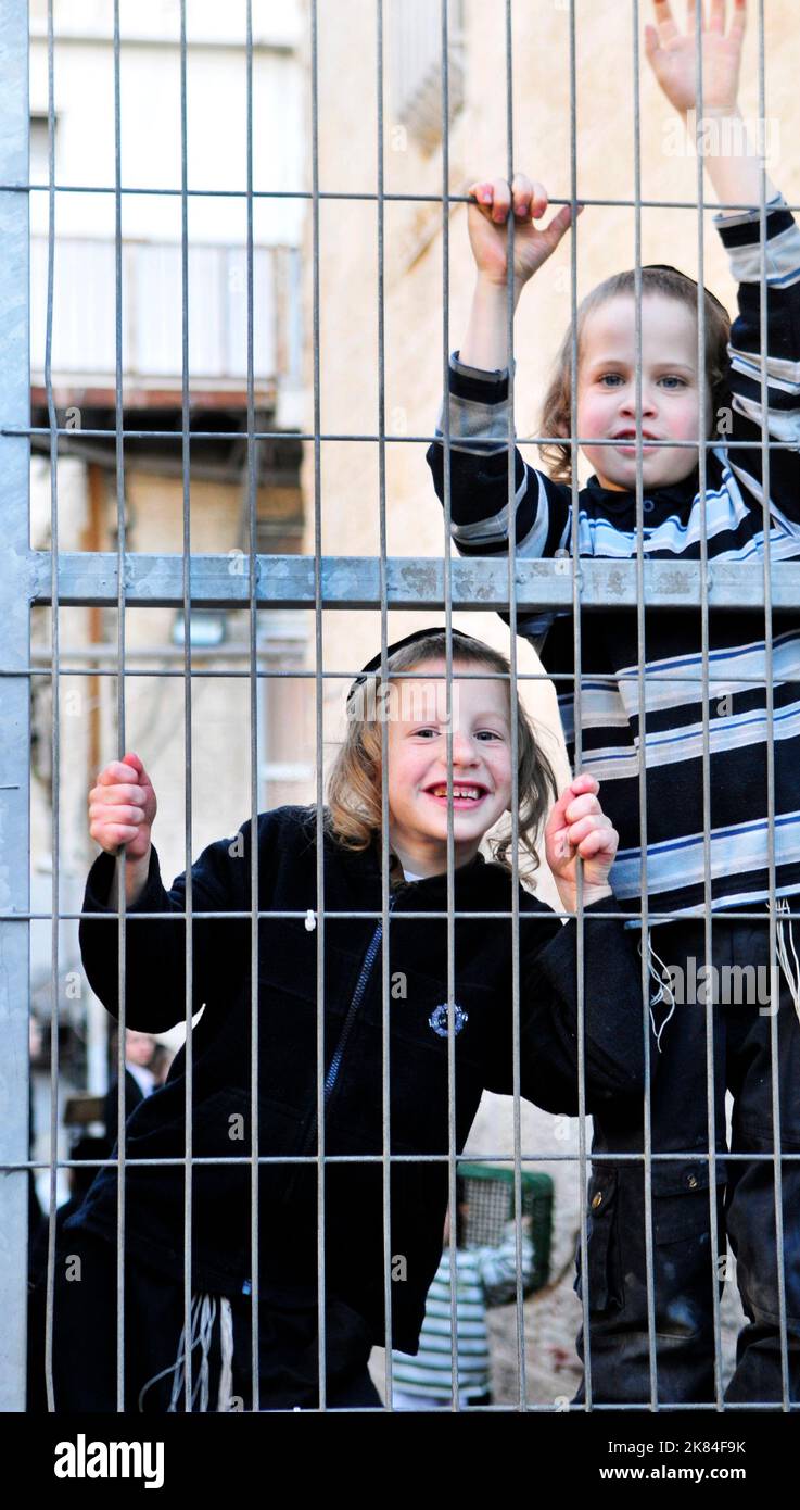Cheerful & happy. Orthodox Jewish boys having fun in the courtyard of their Yeshiva in Jerusalem, Israel. Stock Photo