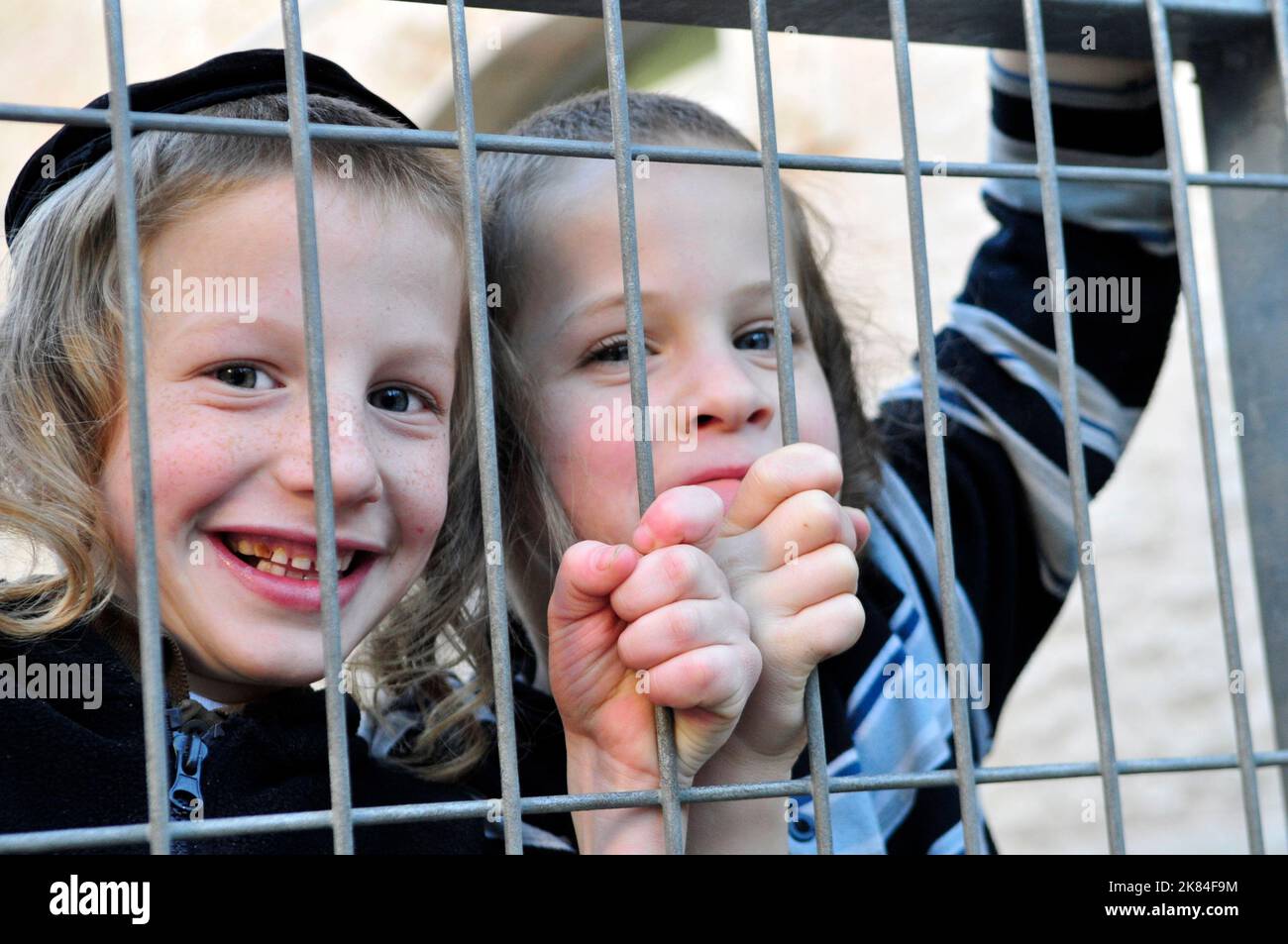 Cheerful & happy. Orthodox Jewish boys having fun in the courtyard of their Yeshiva in Jerusalem, Israel. Stock Photo