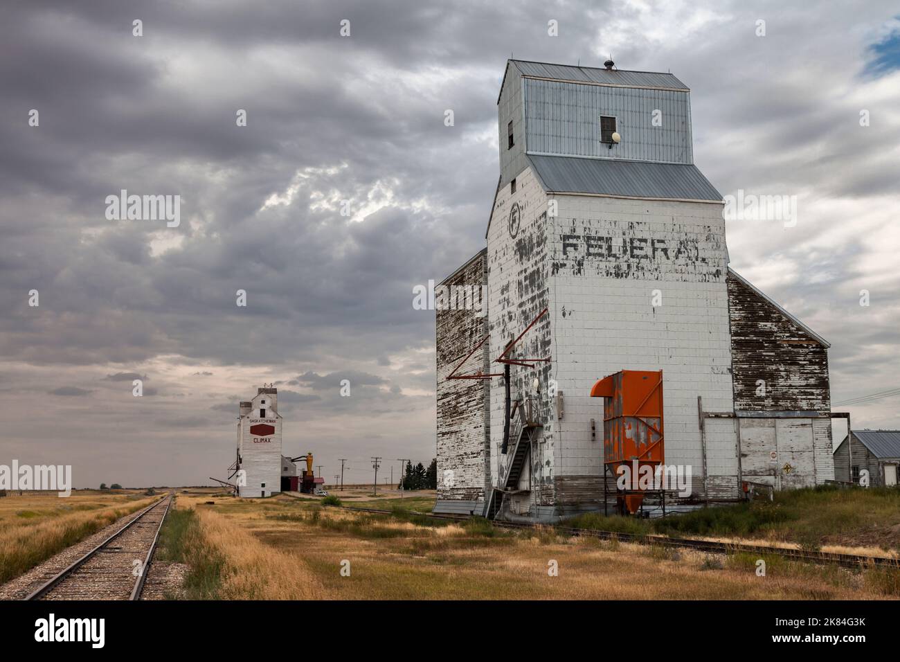 Grain elevators along the spur line in the Saskatchewan Prairie town of Climax. Stock Photo