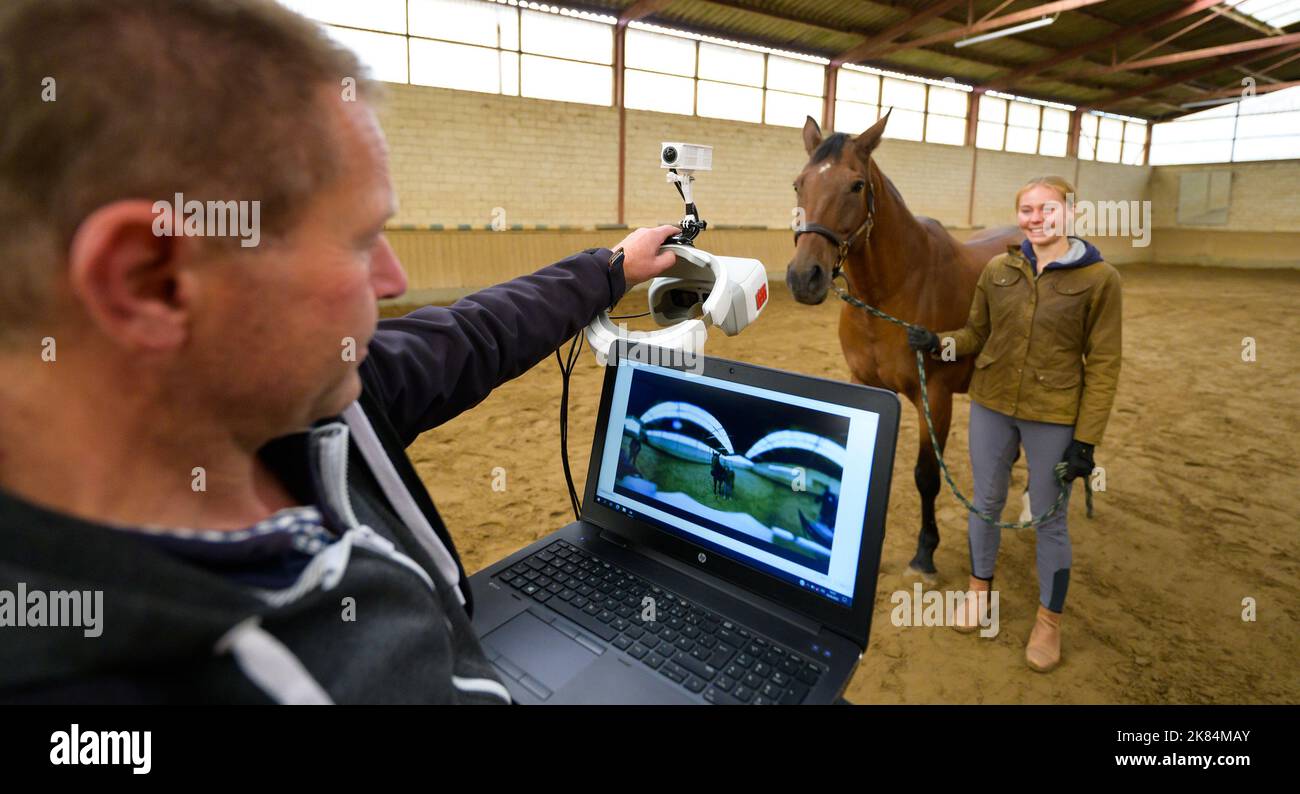 Echem, Germany. 28th Sep, 2022. Benito Weise, from the Agricultural Training Center (LBZ) in Echem, holds the so-called horse goggles in his left hand. An engineer at Lüneburg is developing VR goggles to feel his way into the view of horses. (to dpa 'First the cow glasses, then the horse glasses developed at Lüneburg') Credit: Philipp Schulze/dpa/Alamy Live News Stock Photo