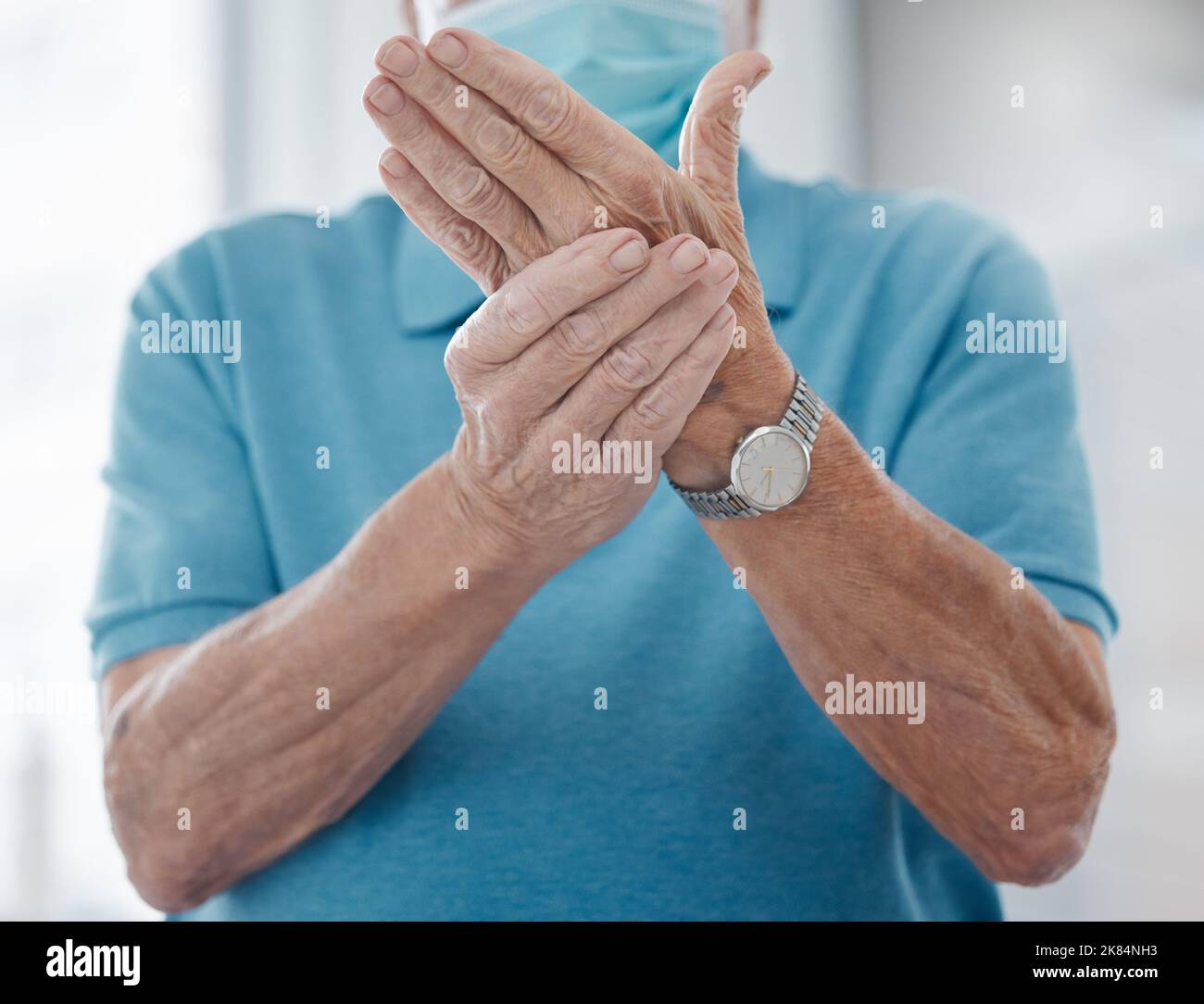 Arthritis is so painful. an unrecognizable man feeling his hands in a